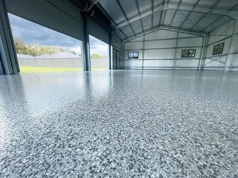Grey flake epoxy floor in a large workshop