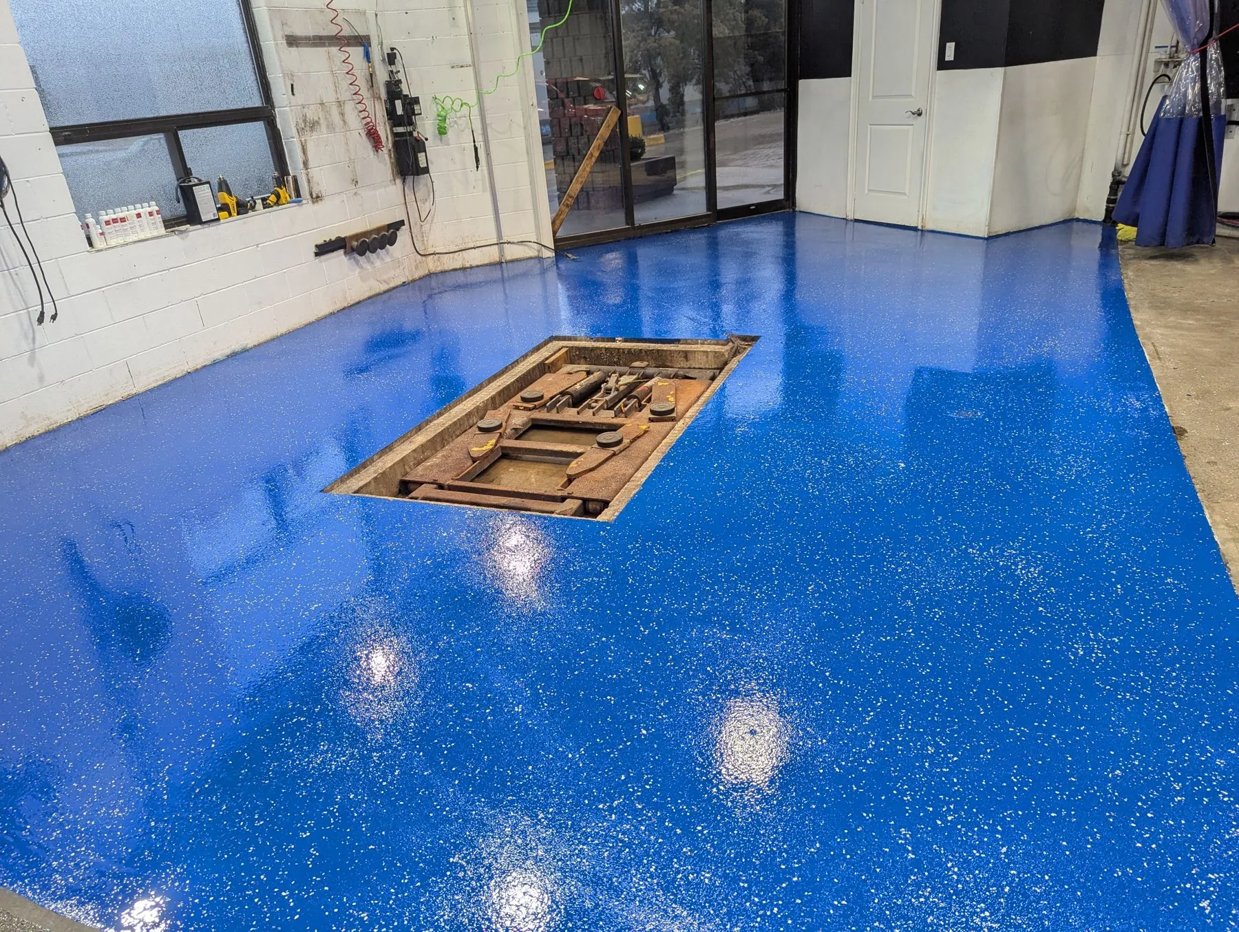 Blue metallic epoxy floor in Oakville